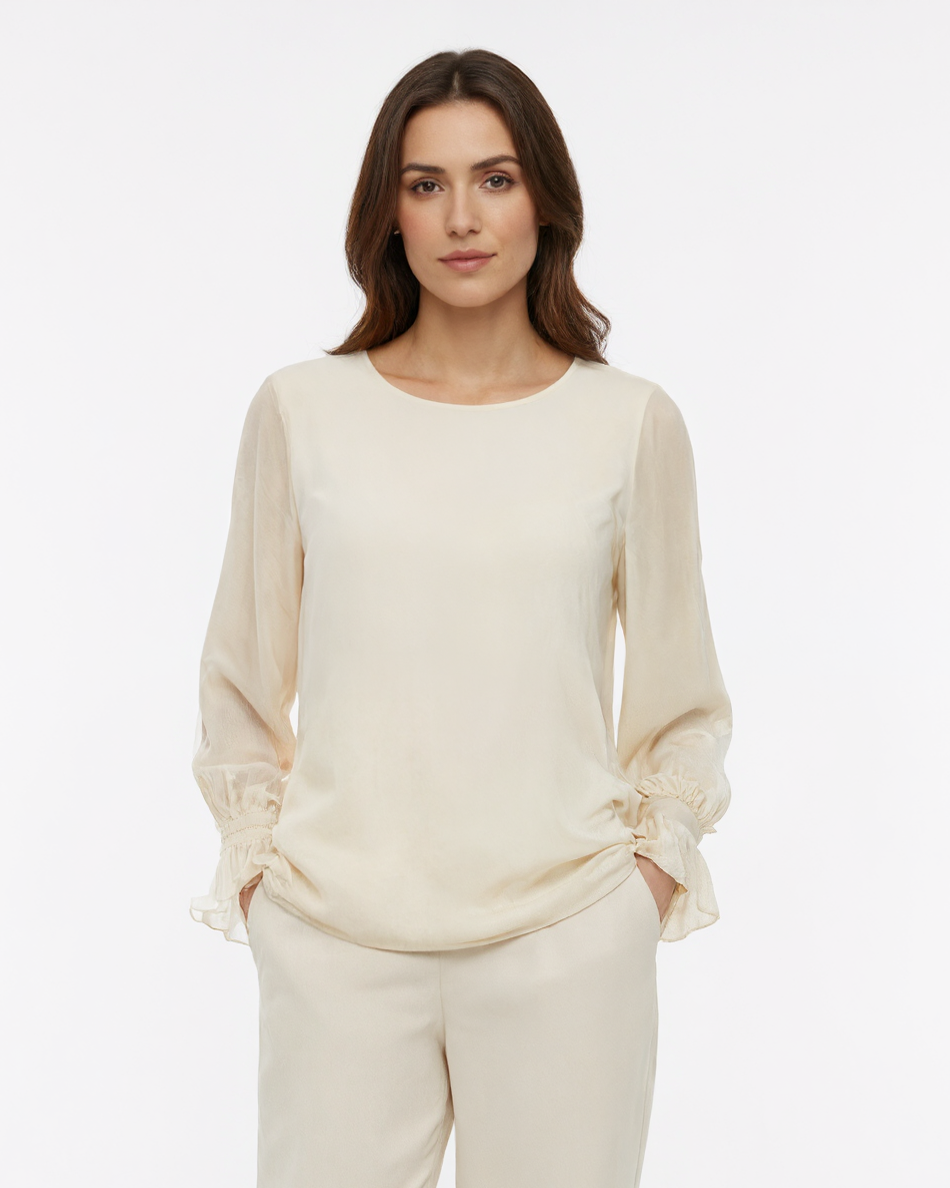 Blusa con maniche ampie, polsino arricciato e goccia sul retro