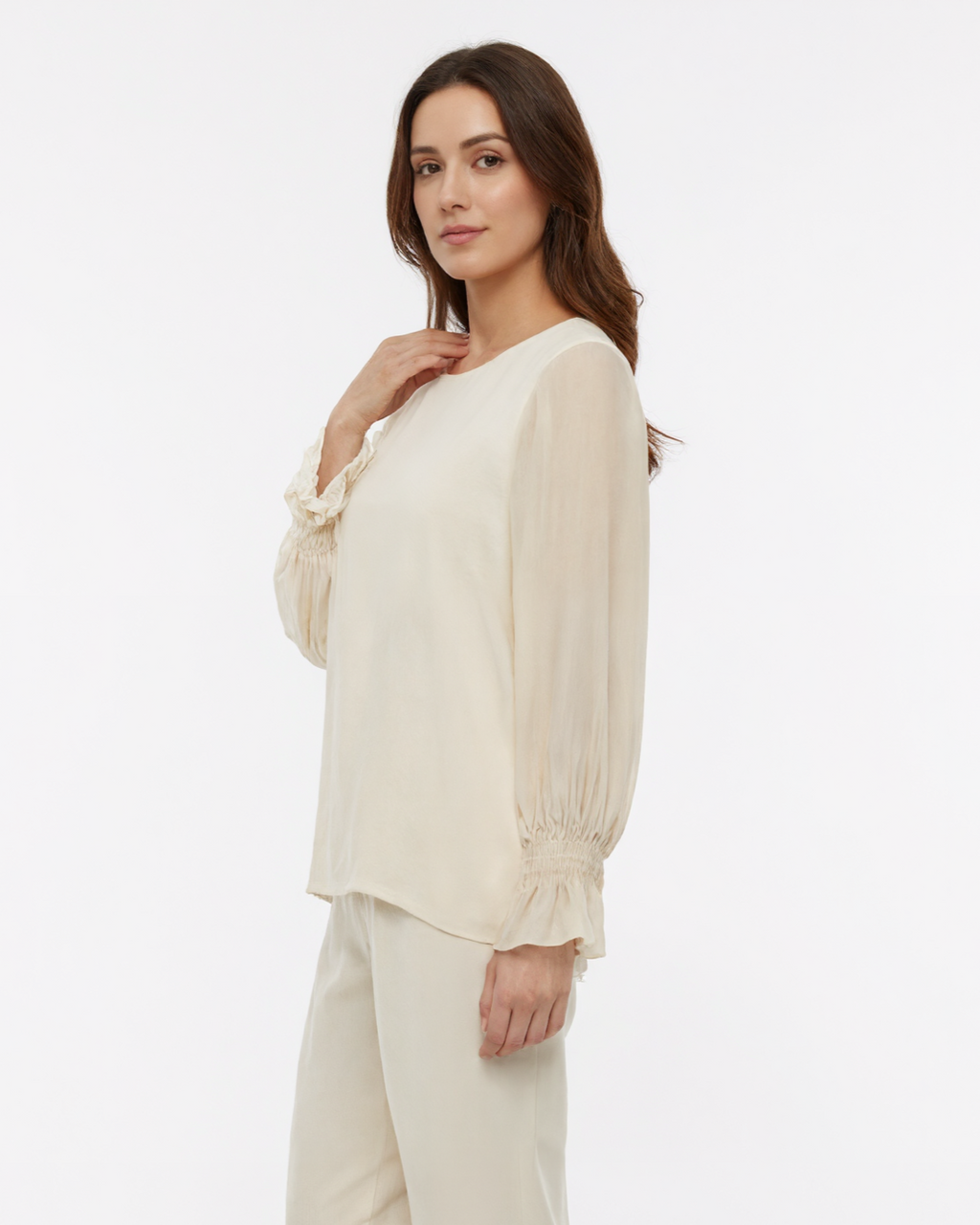 Blusa con maniche ampie, polsino arricciato e goccia sul retro