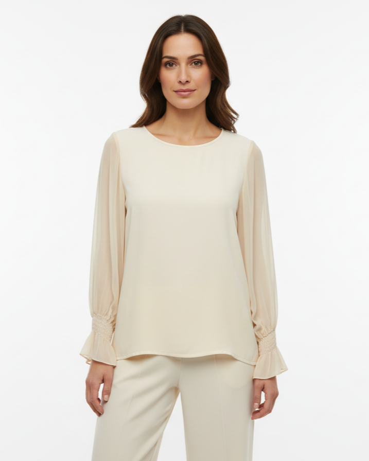 Blusa con maniche ampie, polsino arricciato e goccia sul retro